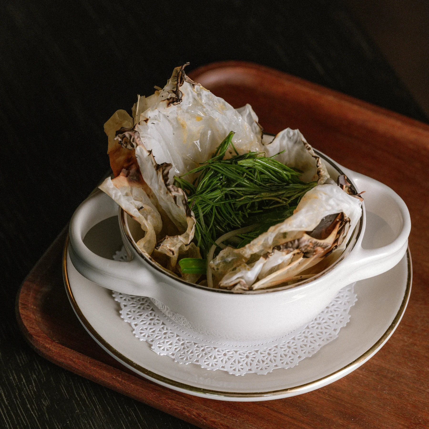 A mixiote served in a white bowl.